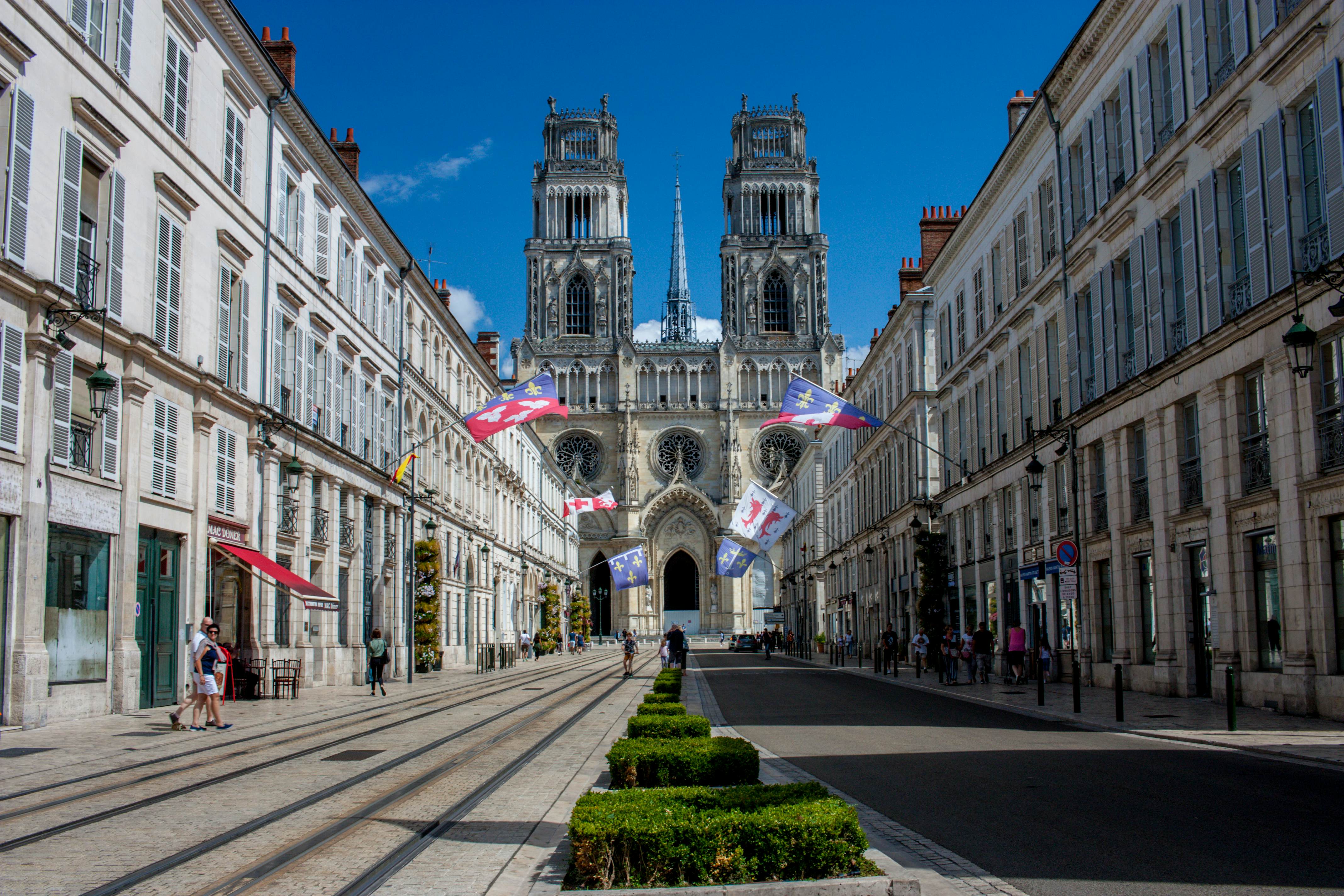 Cathédrale Sainte-Croix rises up above Rue Jeanne d'Arc in Orléans, France.
